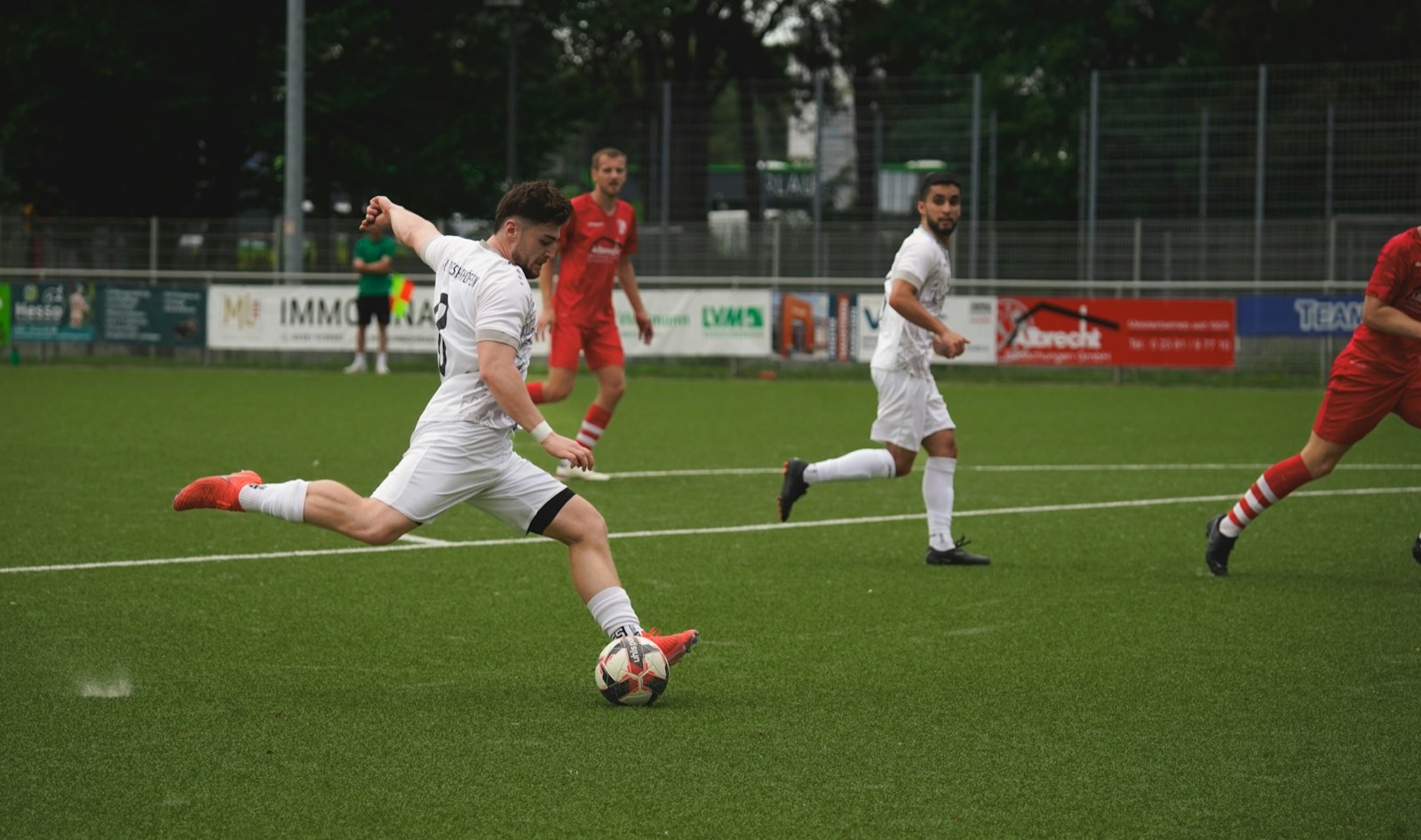Footballers competing in a live match